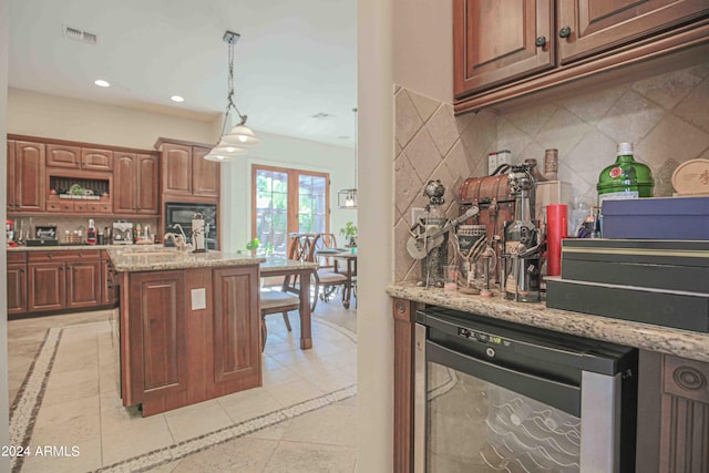 kitchen featuring dishwasher, recessed lighting, tasteful backsplash, and visible vents