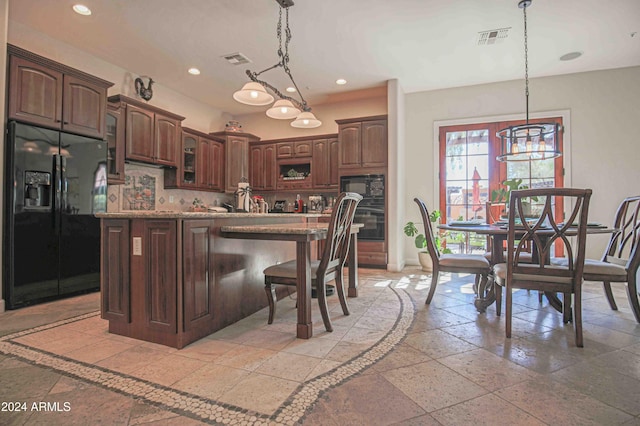 kitchen featuring recessed lighting, baseboards, black appliances, and visible vents