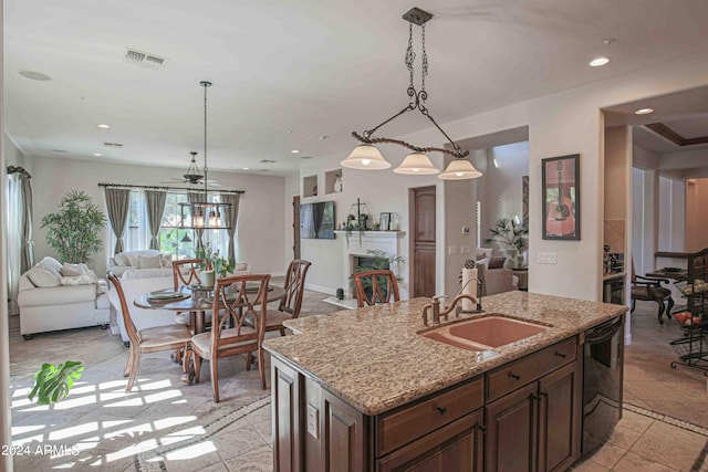 kitchen featuring open floor plan, recessed lighting, a sink, visible vents, and dishwasher