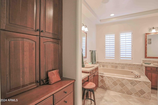full bath featuring tile patterned floors, recessed lighting, vanity, and a garden tub