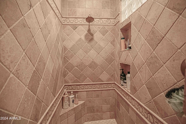 full bathroom with a tile shower