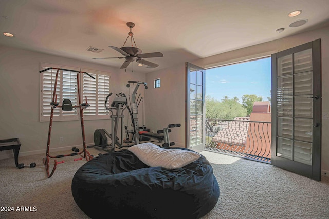 workout area featuring a ceiling fan, carpet floors, baseboards, and visible vents