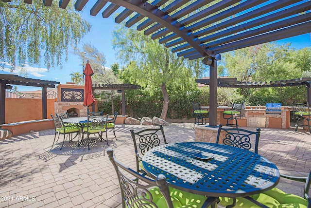 view of patio / terrace featuring an outdoor stone fireplace, area for grilling, outdoor dining area, a grill, and a pergola