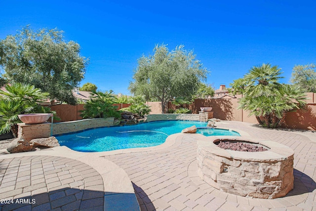 view of pool featuring a fenced backyard, a fenced in pool, and a patio