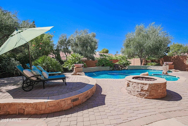 view of pool with a fire pit, a fenced in pool, a fenced backyard, and a patio area