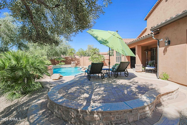 view of patio / terrace with a fenced backyard and a fenced in pool