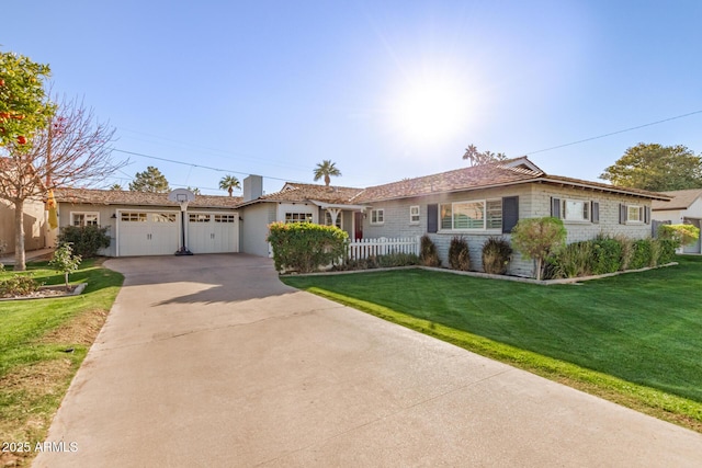 single story home with a front yard and a garage