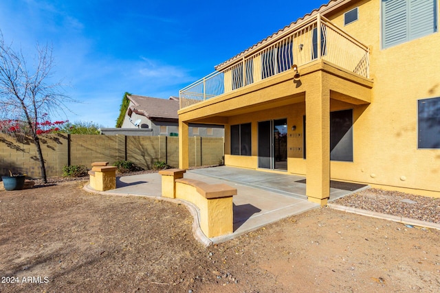 rear view of house featuring a patio