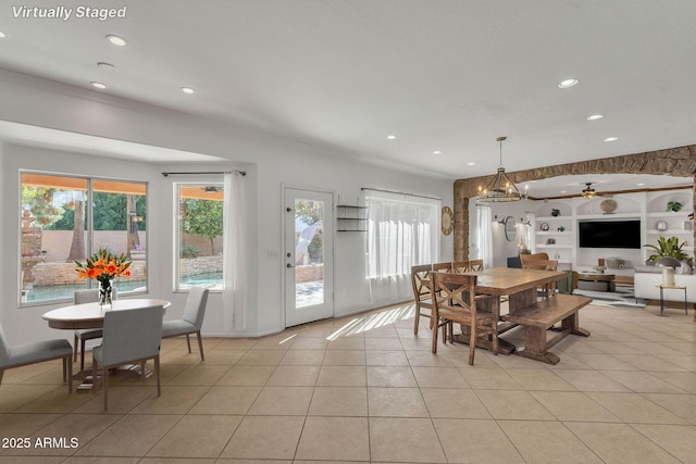 dining area featuring light tile patterned floors, ornamental molding, recessed lighting, and built in features