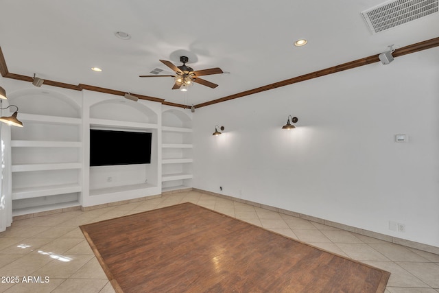 unfurnished living room with built in shelves, visible vents, ornamental molding, light tile patterned flooring, and ceiling fan