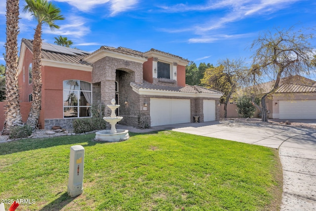 mediterranean / spanish-style house featuring stucco siding, a front yard, stone siding, driveway, and a tiled roof