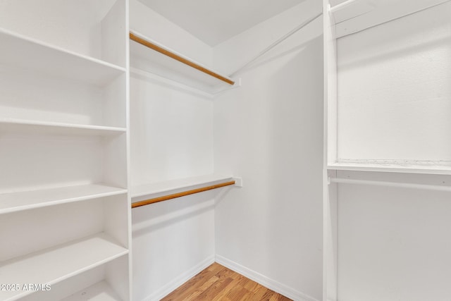 spacious closet with wood finished floors