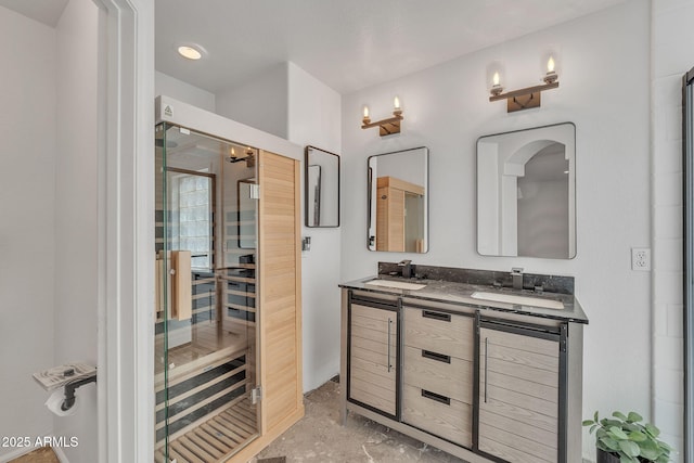 bathroom with a sink and double vanity