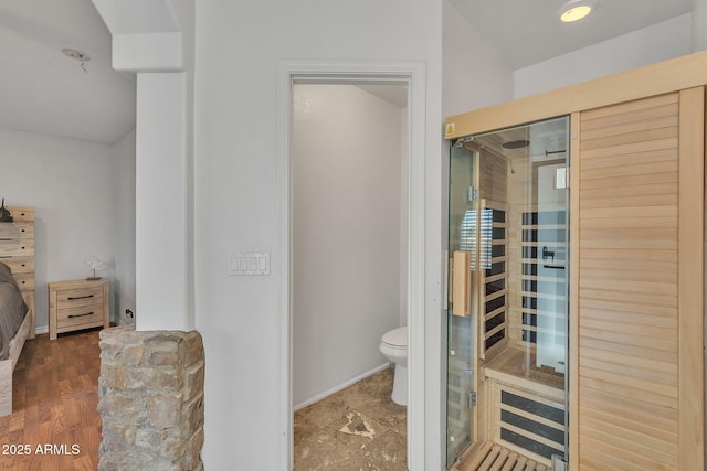 bathroom featuring a sauna and toilet