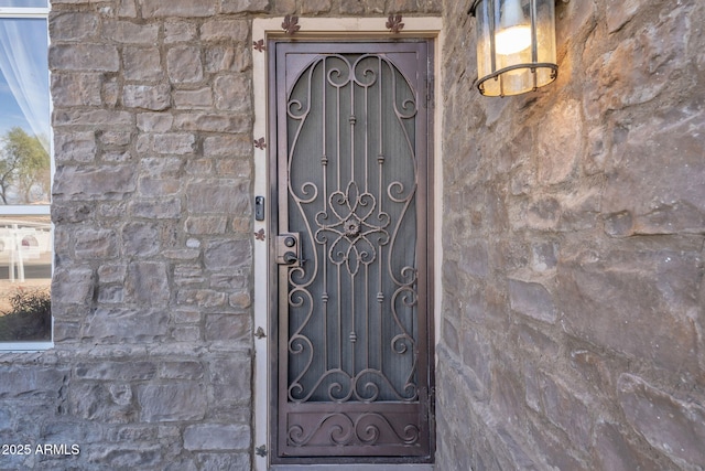 view of exterior entry with stone siding