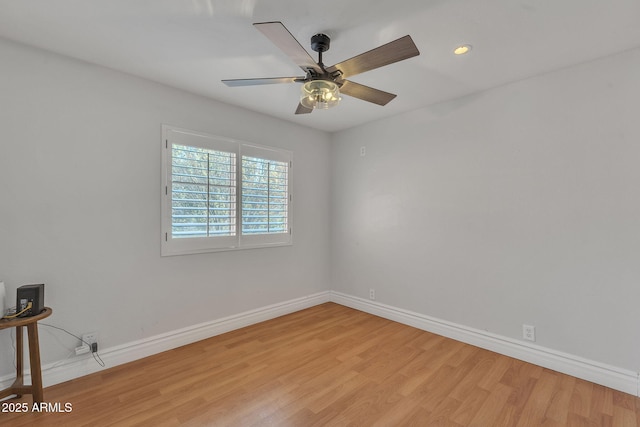 unfurnished room with ceiling fan, light wood finished floors, recessed lighting, and baseboards