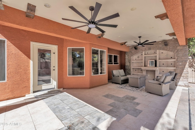 view of patio featuring an outdoor living space and a ceiling fan