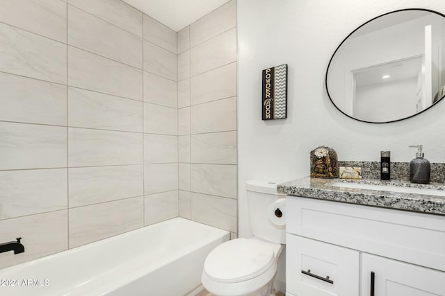 full bathroom with vanity, toilet, and tiled shower / bath