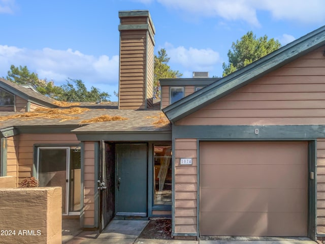 view of front of property with a garage