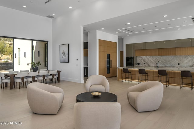 living room featuring a high ceiling