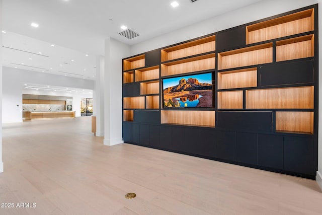 unfurnished living room featuring light wood-type flooring