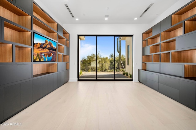 unfurnished living room with light hardwood / wood-style floors