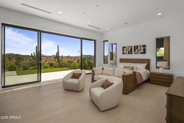 bedroom with light hardwood / wood-style floors