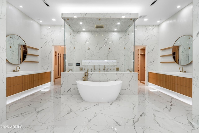 bathroom with vanity, a bathtub, and a high ceiling