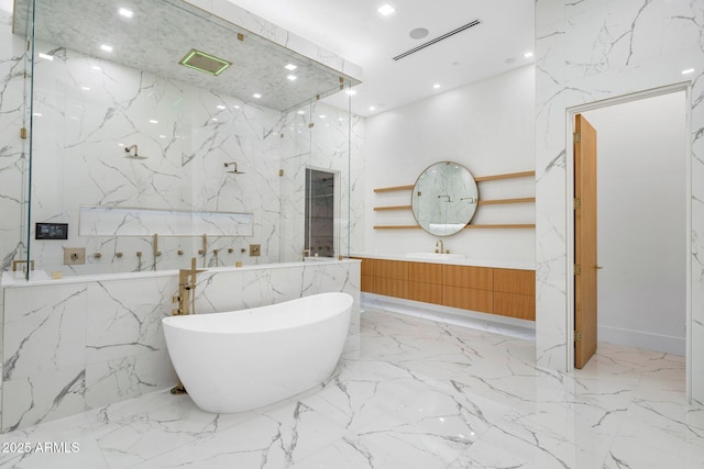 bathroom with vanity and a washtub