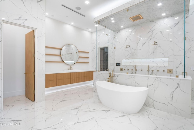 bathroom featuring vanity and a bathing tub