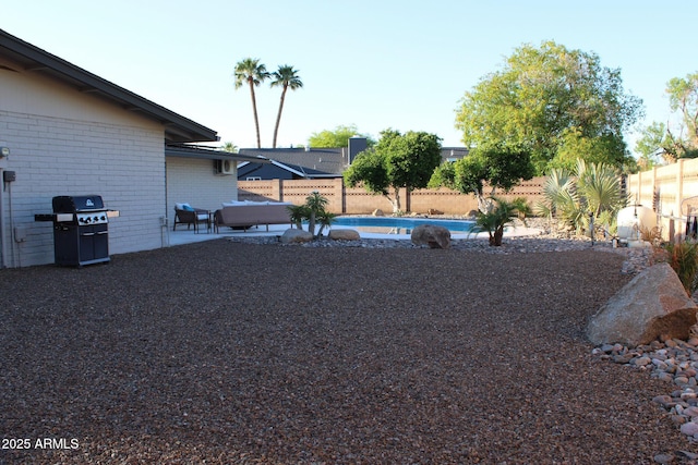 202 N Florence Ave, Litchfield Park, AZ 85340 - fenced backyard with a patio area and an outdoor hangout area