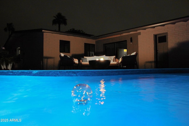 202 N Florence Ave, Litchfield Park, AZ 85340 - pool at twilight with outdoor lounge area and an outdoor pool