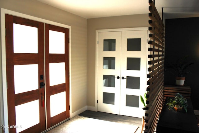 202 N Florence Ave, Litchfield Park, AZ 85340 - entrance foyer with french doors, wood finished floors, and baseboards