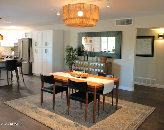 202 N Florence Ave, Litchfield Park, AZ 85340 - dining space with dark wood finished floors and baseboards
