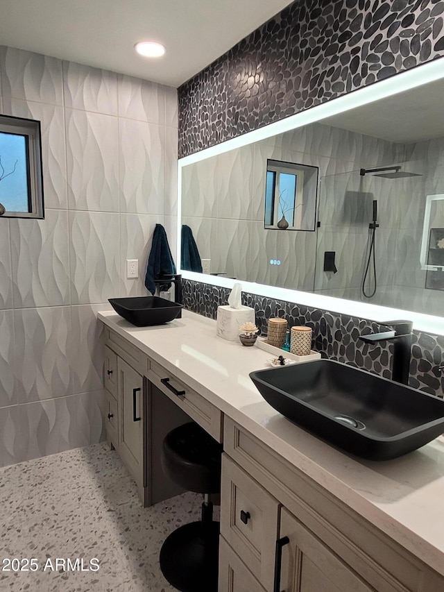 202 N Florence Ave, Litchfield Park, AZ 85340 - full bathroom featuring tile walls, walk in shower, double vanity, tasteful backsplash, and recessed lighting