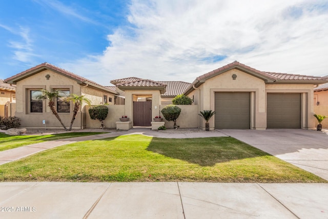 mediterranean / spanish-style home featuring a garage and a front lawn