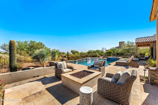 view of patio with an outdoor fire pit and a fenced in pool