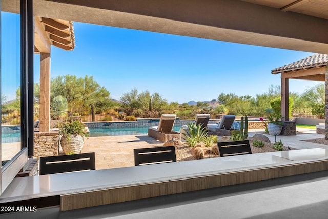 view of patio / terrace featuring a fenced in pool