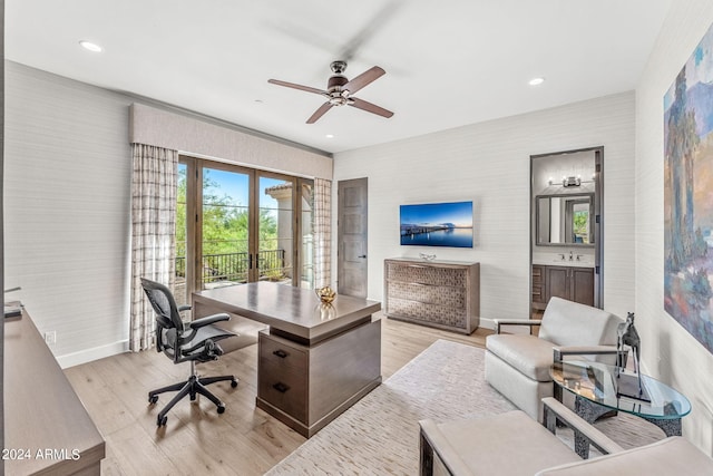 home office with ceiling fan, sink, light hardwood / wood-style flooring, and french doors