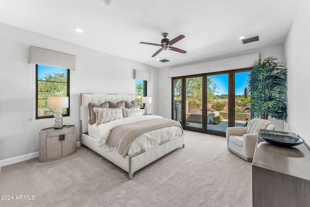 bedroom featuring light colored carpet, ceiling fan, and access to exterior