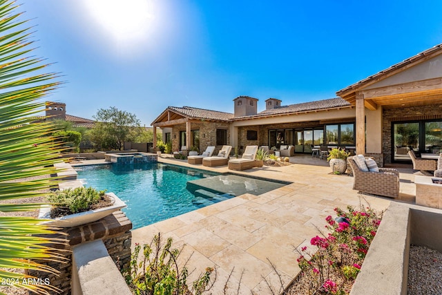 view of swimming pool with outdoor lounge area and a patio area