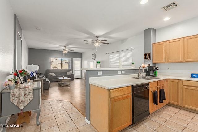 kitchen featuring open floor plan, light countertops, dishwasher, and a peninsula