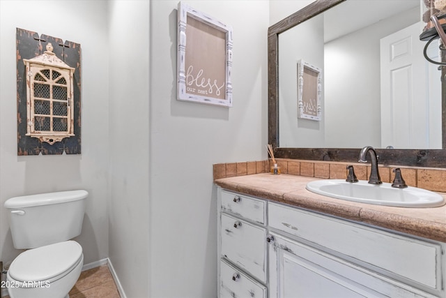 3019 W Trail Dr, Phoenix, AZ 85086 - bathroom with tile patterned floors, vanity, and toilet