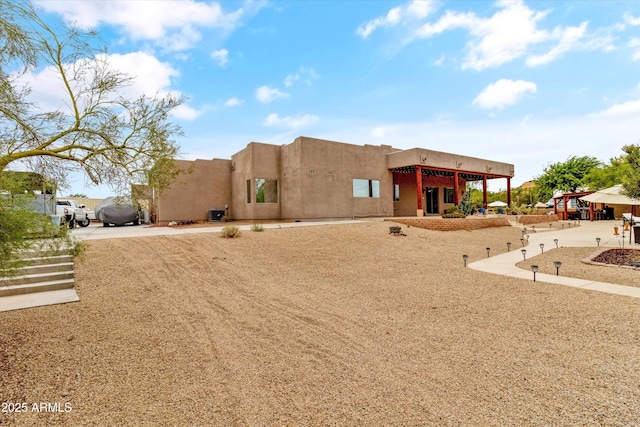 3019 W Trail Dr, Phoenix, AZ 85086 - pueblo-style home with stucco siding