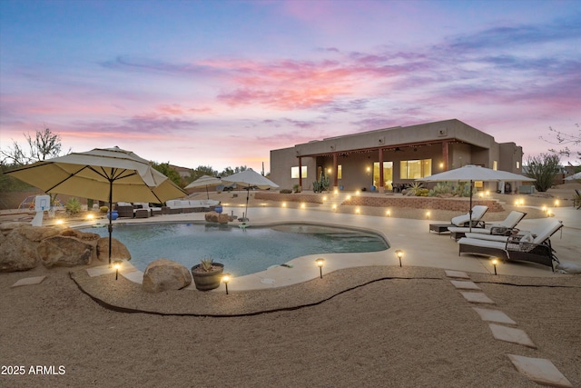 3019 W Trail Dr, Phoenix, AZ 85086 - pool at dusk with an outdoor pool and a patio