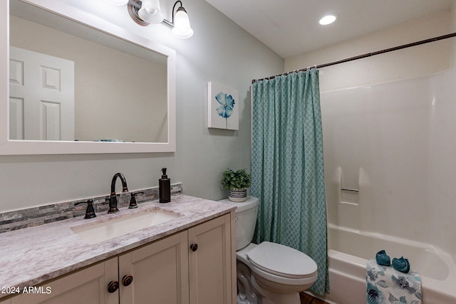 bathroom with toilet, vanity, shower / bath combo with shower curtain, and recessed lighting