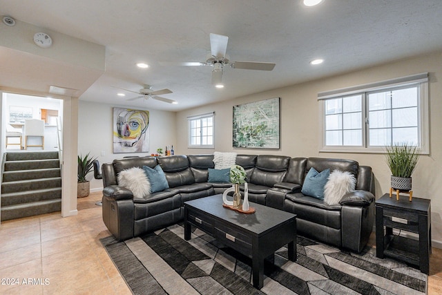 living room with stairs, a ceiling fan, recessed lighting, and light tile patterned floors