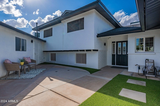 back of house featuring a patio