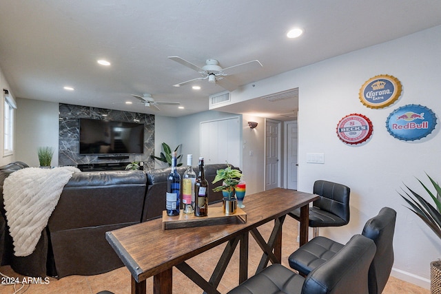 living area featuring a ceiling fan, visible vents, and recessed lighting