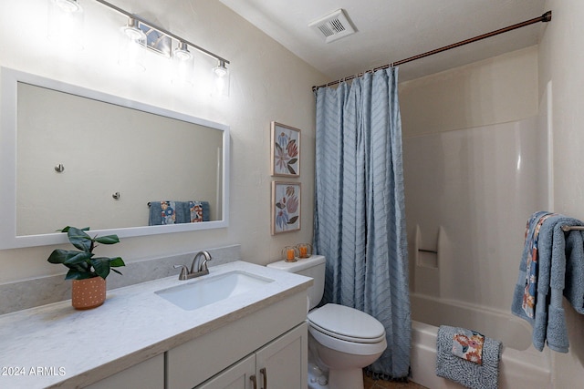 full bathroom with visible vents, toilet, vanity, and shower / bath combo with shower curtain